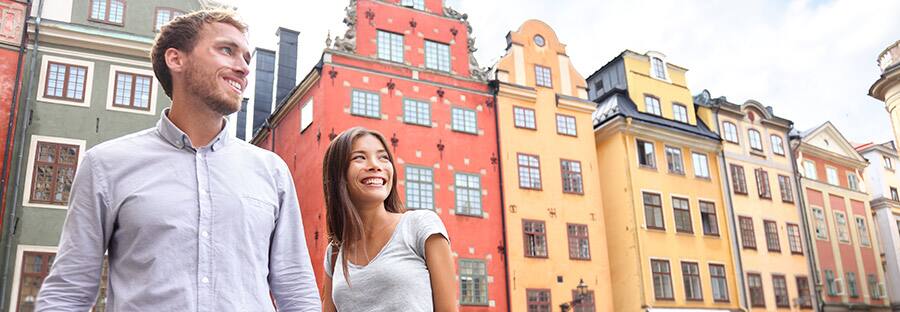 A couple holding hands explores on a Baltic cruise