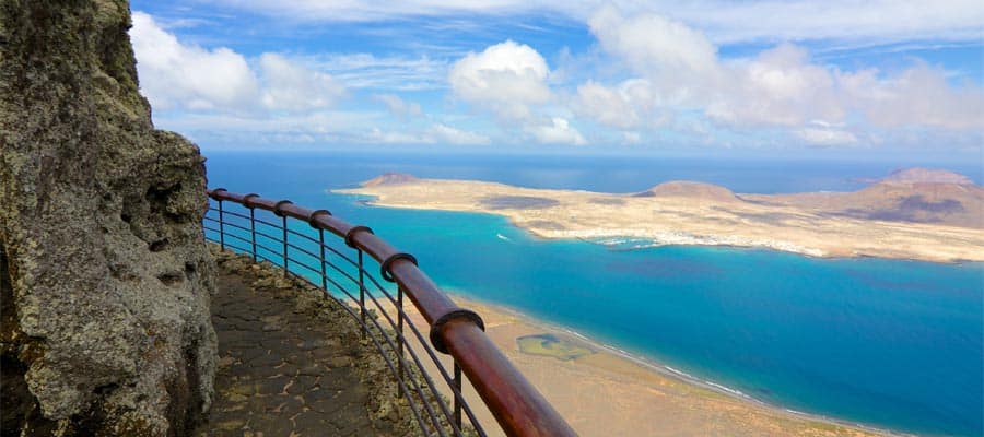 Volcanic coastline and Isla Graciosa on your Arrecife cruise
