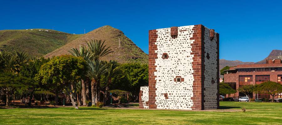 Explore Torre del Conde, a 15th century fortress surrounded by a lush green park
