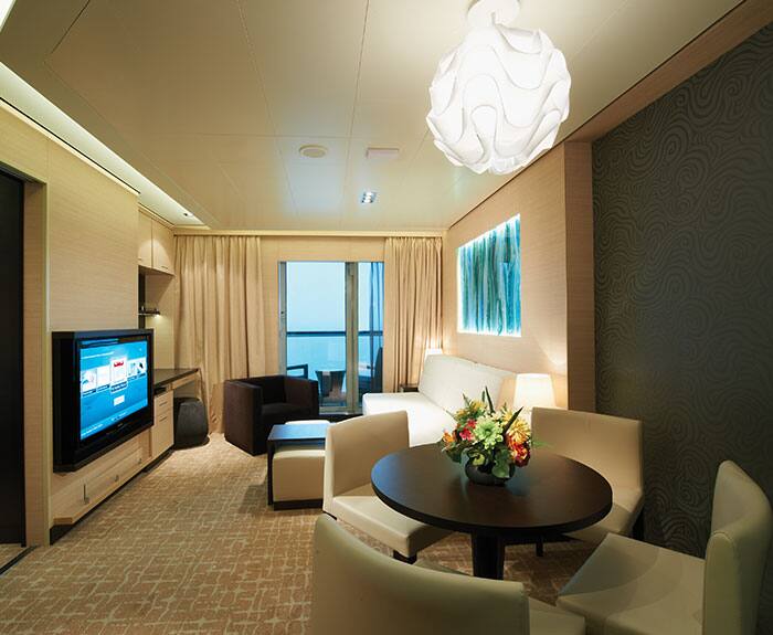 The Haven's 2-Bedroom Family Villa with Balcony Living Room on Norwegian Breakaway