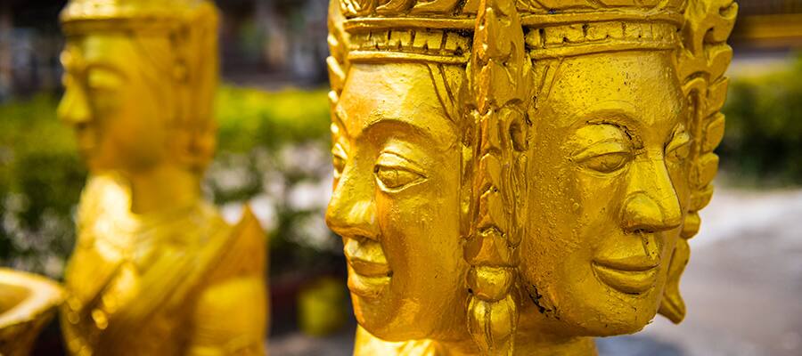 Golden Buddhist Statues on your cruise to Sihanoukville