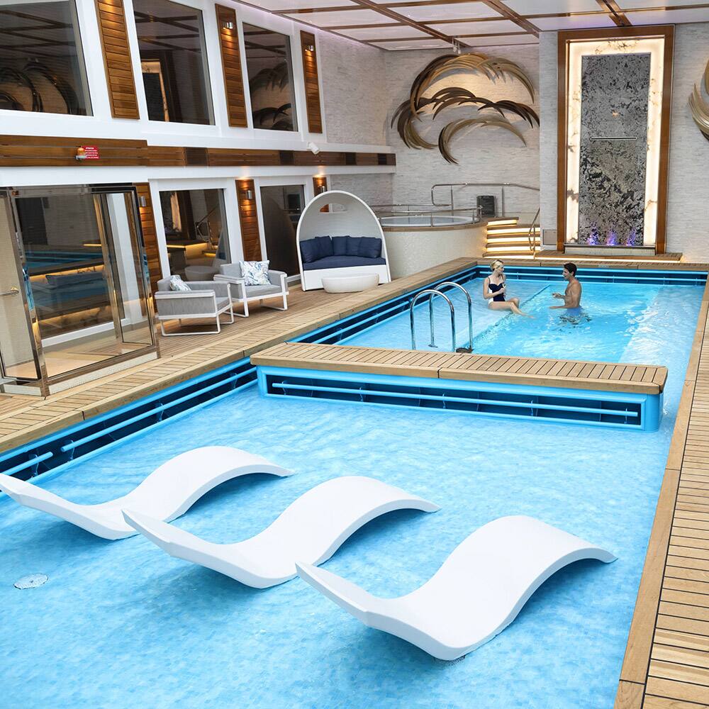 Enjoy a last-minute cruise vacation onboard the top deck of the ship overlooking the pool with a beverage